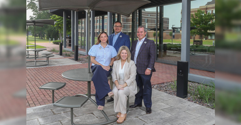 Photo: (from left) Amber Lawrence, Brandy Eldridge, Jay Davis, and Fred Meisenheimer pose for a photo on the A&M-Texarkana campus. The group of TAMUT employees are all recent hires who have joined the university staff from successful carers outside of the education arena.