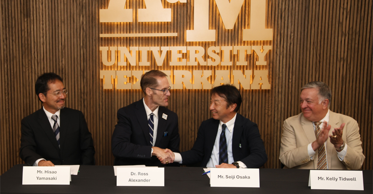  Texas A&M University-Texarkana President Dr. Ross Alexander shakes hands with Mr. Seiji Osaka, CEO of AIST Solutions Co. after the two parties signed a research and academic partnership. The partnership marks the first time that the Japan-based company has formed a collaboration with an American university. Also pictured are Hisao Yamasaki, Managing Director, AIST Solutions America LLC and Kelly Tidwell, Patton, Tidwell & Culbertson, L.L.P.