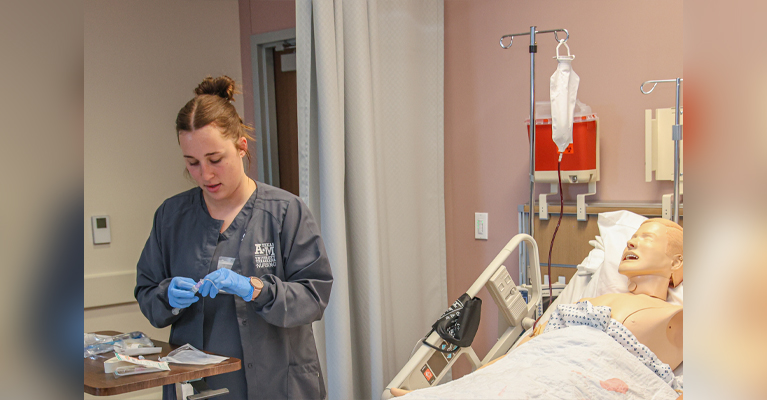 TAMUT nursing student Camryn Waibel practices starting an IV in one of the University's nursing labs. As part of TAMUT's expanding academic offerings there will be several new health care-related programs launched to support area needs.